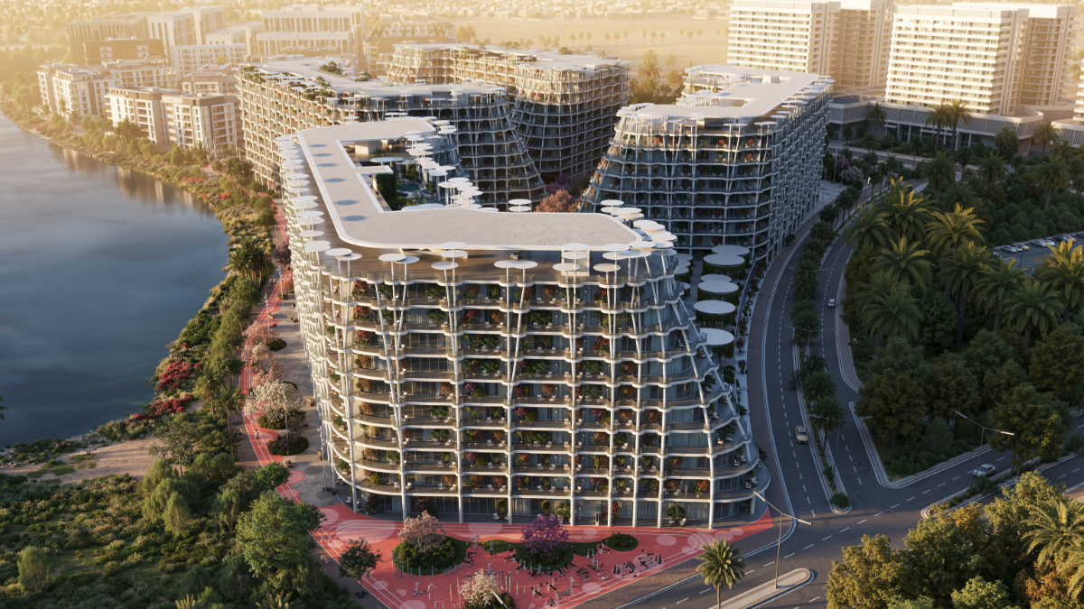 أبراج سكنية محاطة بمسطحات مائية ومناظر طبيعية استوائية — Residential towers surrounded by lagoons and tropical landscaping.