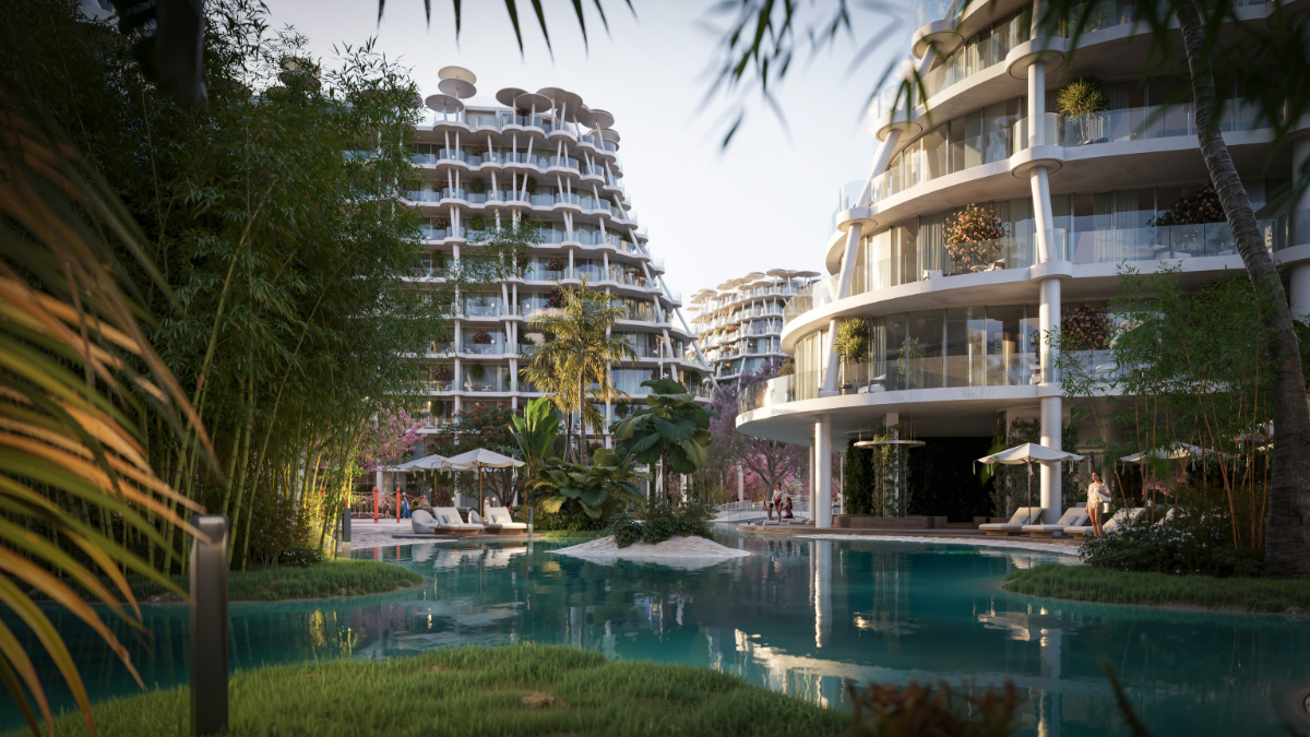 "مشهد خارجي يوضح أبراج مشروع مستوحى من التصميم الياباني مع مساحات خضراء وبحيرات مائية في دبي — Japanese-inspired residential towers with lush greenery and water features in Dubai."